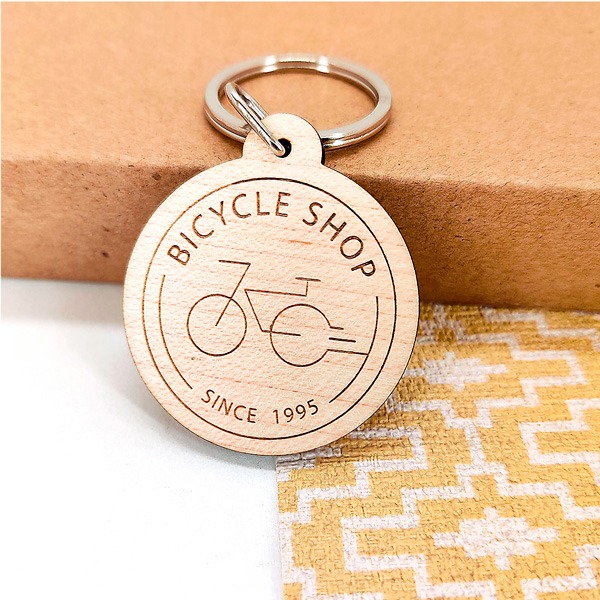 Porte-clés en bois gravé logo professionnel publicité entreprise vélo